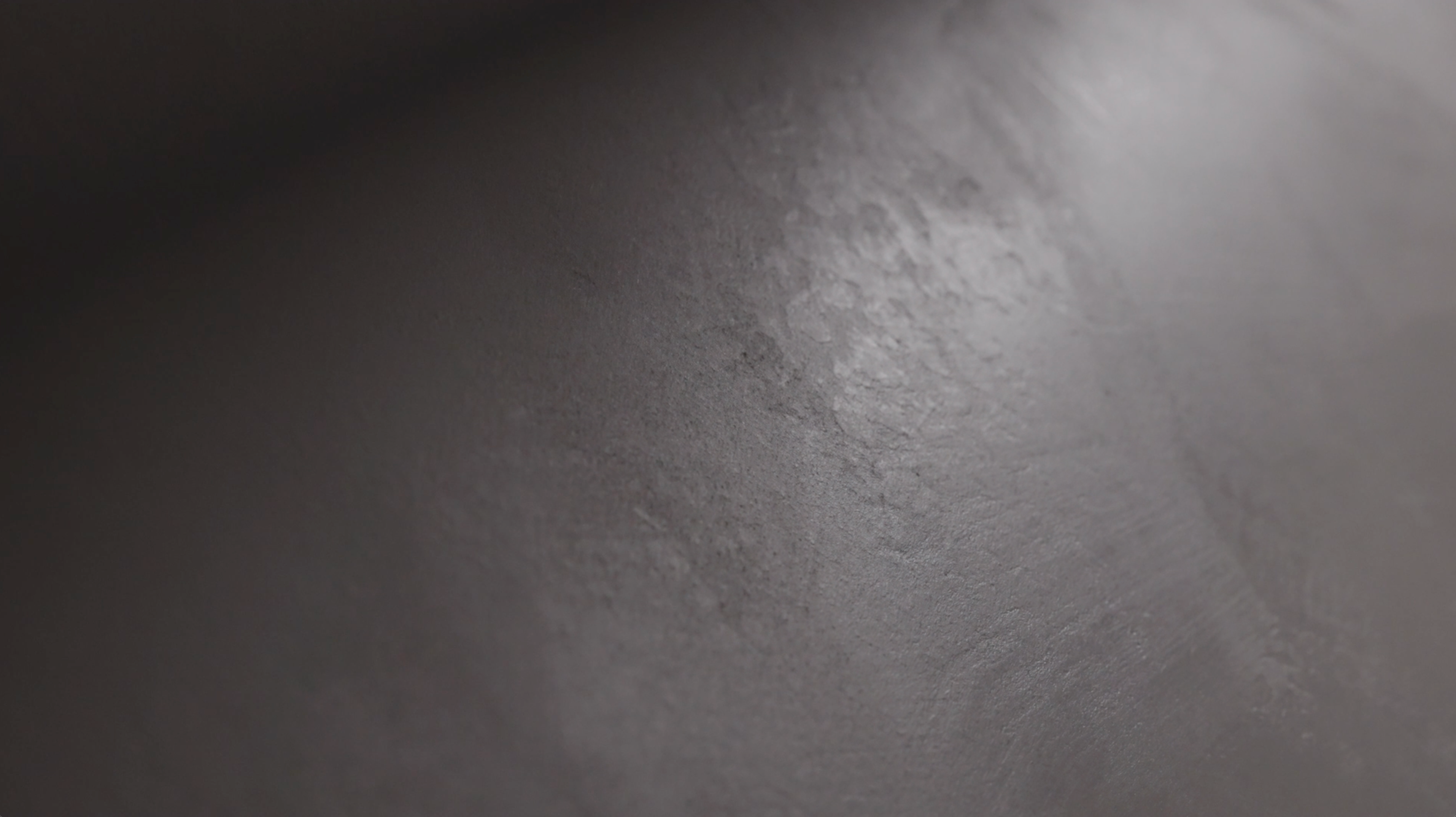 VIOLANTE Rialto matte lime plaster texture closeup in charcoal gray