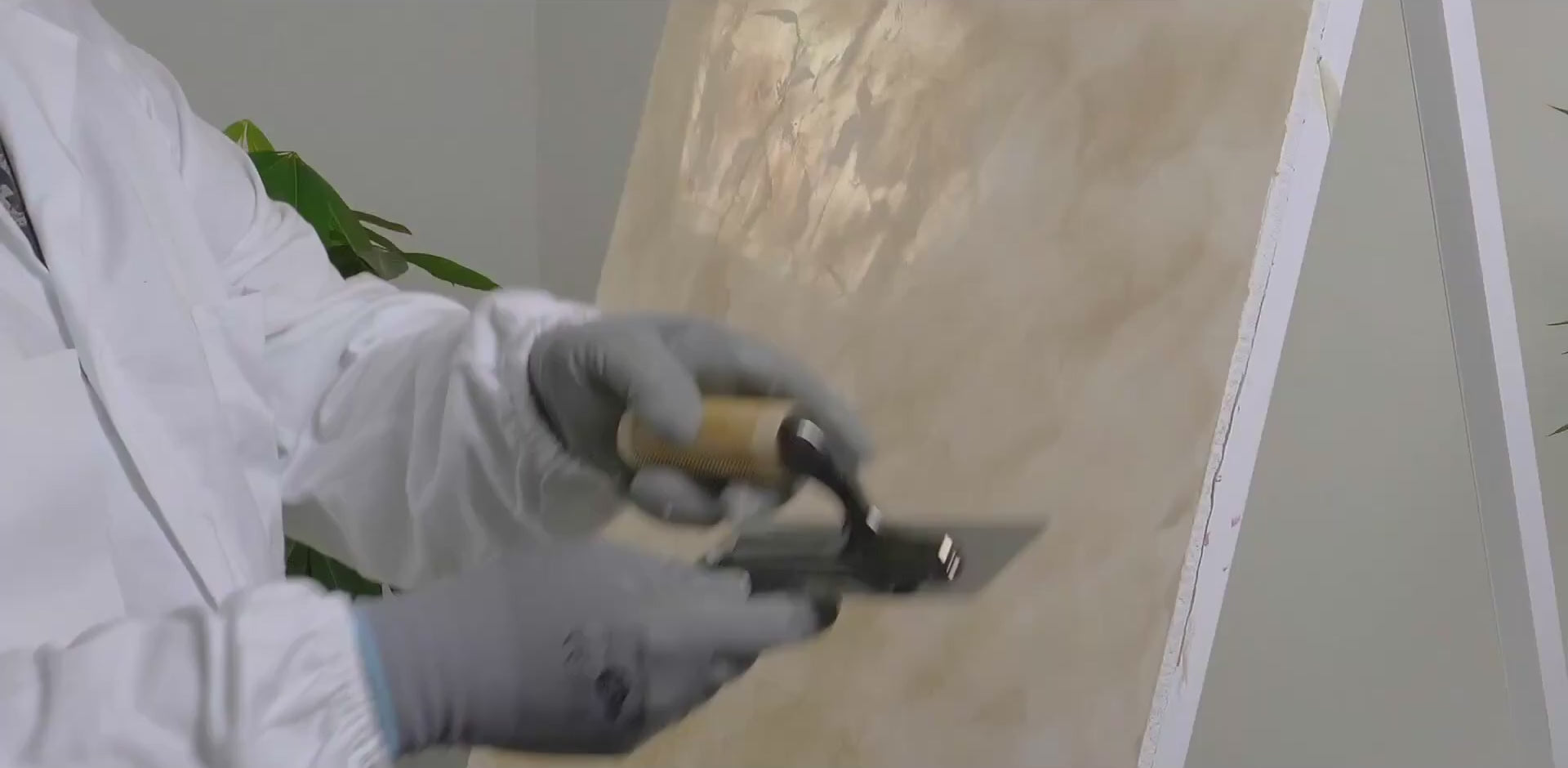 How to burnish VIOLANTE Grassello Venetian plaster with clean stainless steel trowel to develop marble-like gloss